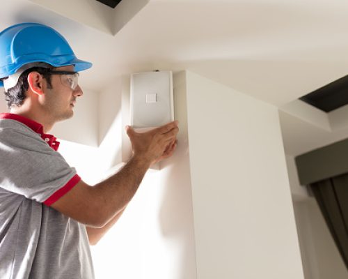 Electrician installing speaker